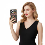 Woman holding a phone with a colorful case against a white background