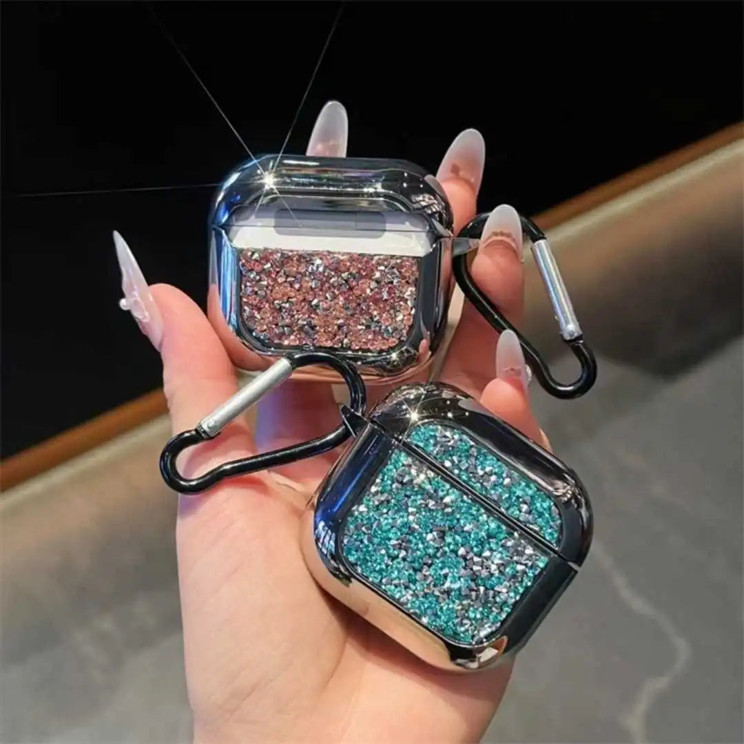 Glittery airpods case with carabiner held by a hand