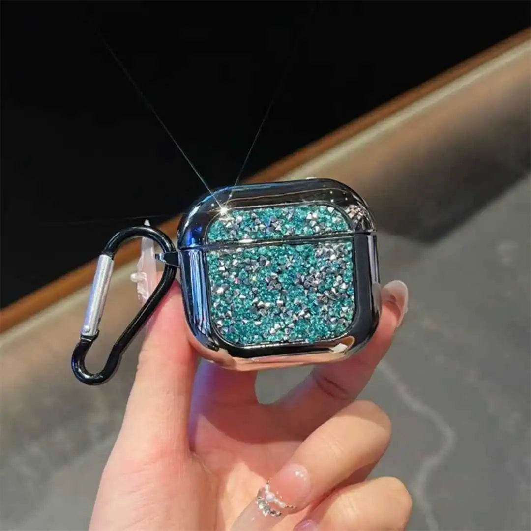 Turquoise glittery airpod case with carabiner held by a hand