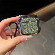 Hand holding a glittery green airpods case