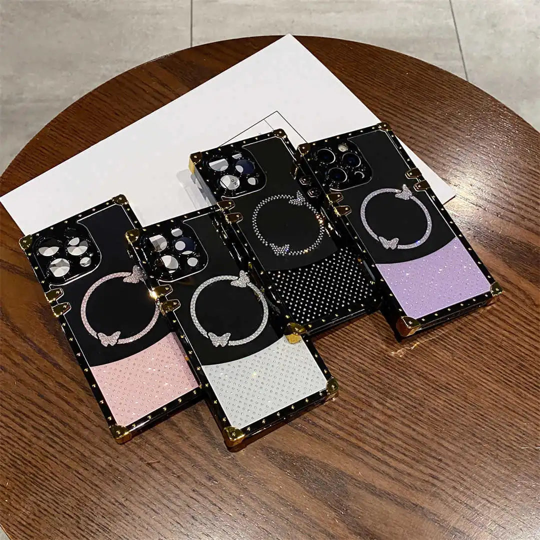 Set of phone cases with different designs on a wooden surface