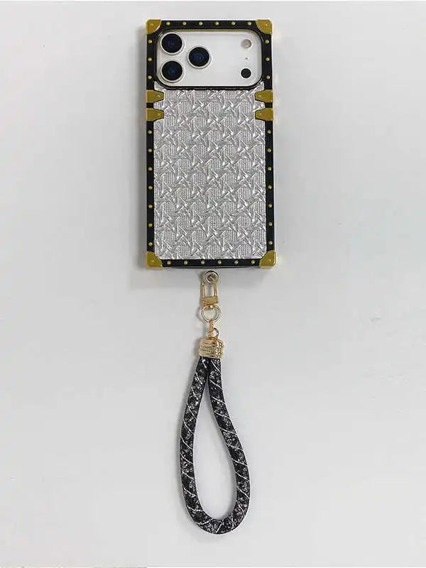 Phone case with woven pattern and strap on a white background