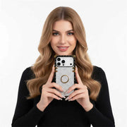 Woman holding a smartphone with a decorative case against a white background