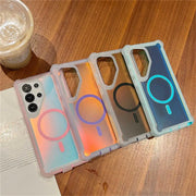 Four Galaxy phone cases with different designs on a wooden surface.