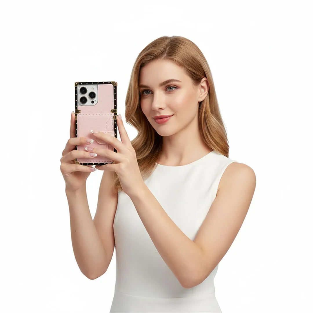 Woman holding a pink smartphone with a white background