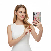 a woman holdiing a phone in pink glitter square iPhone case