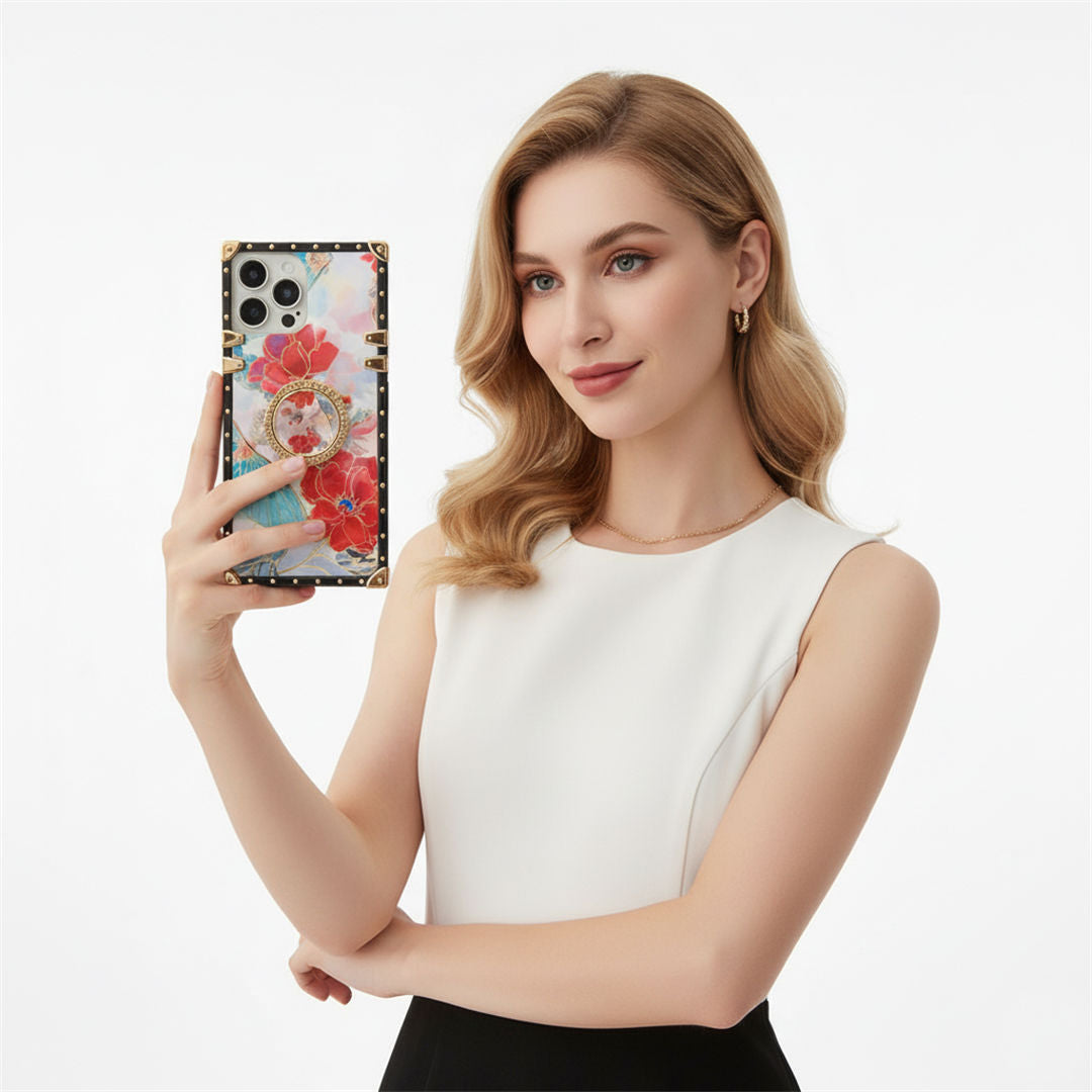 Woman holding a phone with a floral case against a white background