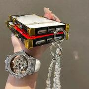 Phone case with intricate design held by a hand, featuring a star-shaped pendant.