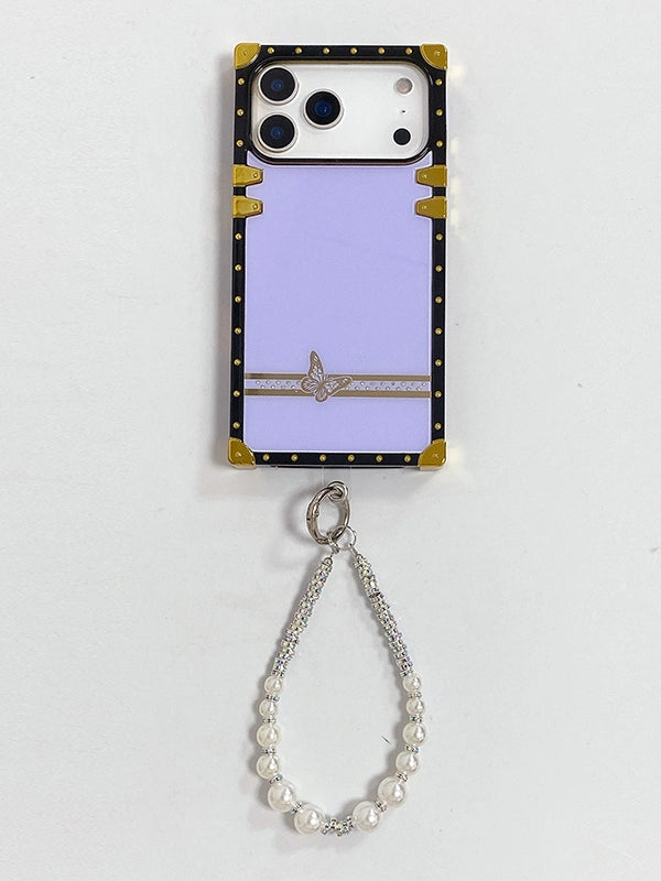 iPhone 17 Pro case with butterfly charm and pearl strap on a white background