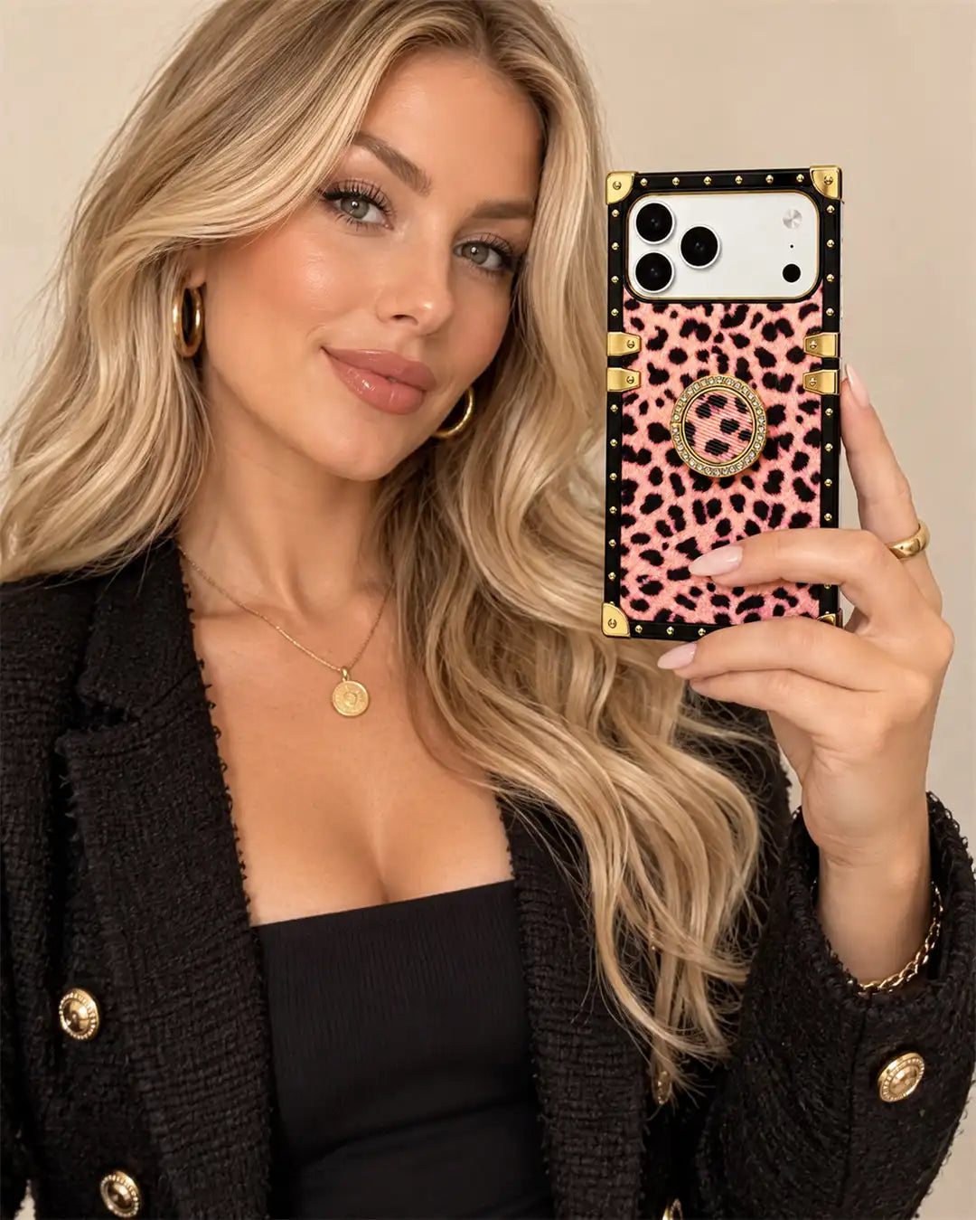 a woman is taking a selfie with a leopard square trunk iPhone case