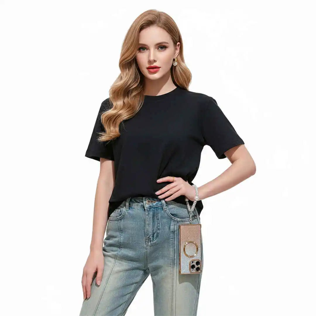Woman wearing a black t-shirt and light blue jeans on a white background
