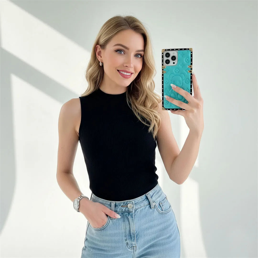 Woman holding a phone with a embossing iphone case against a white background