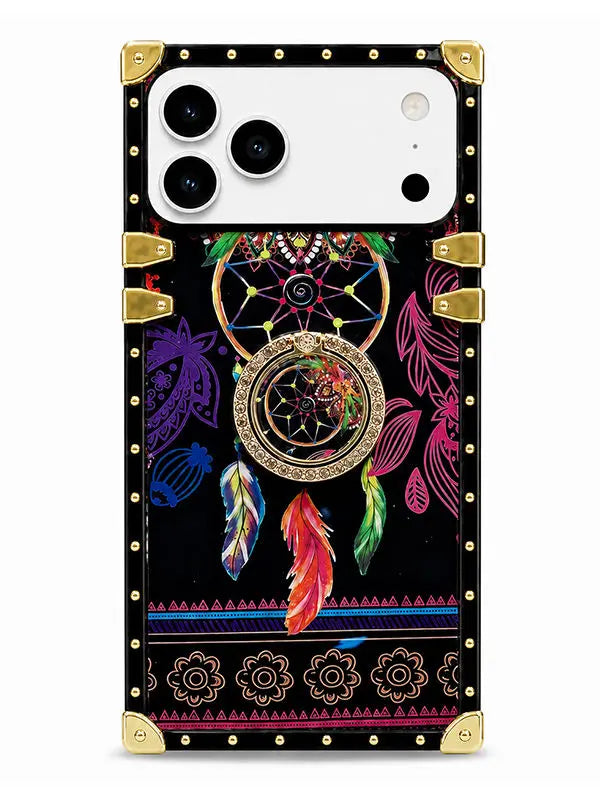 A protective phone case with a black background featuring a colorful dreamcatcher design, gold metal corner guards, and a decorative border pattern.