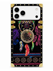 A protective phone case with a black background featuring a colorful dreamcatcher design, gold metal corner guards, and a decorative border pattern.