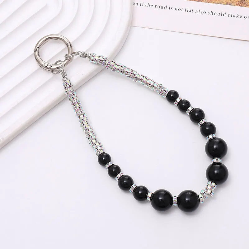 silver phone charm with black pearls