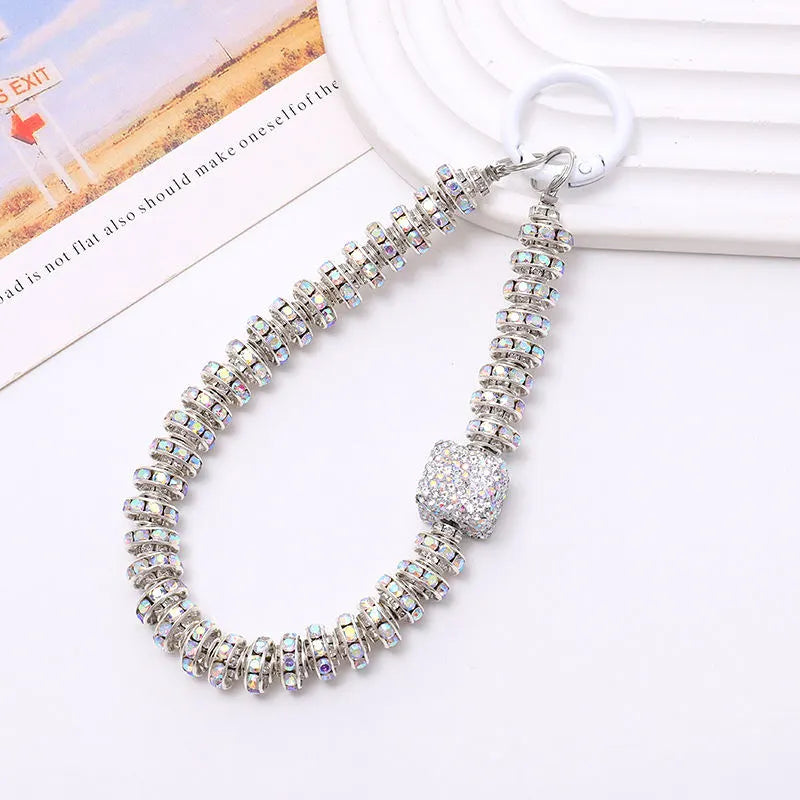 silver phone charm with diamonds cube