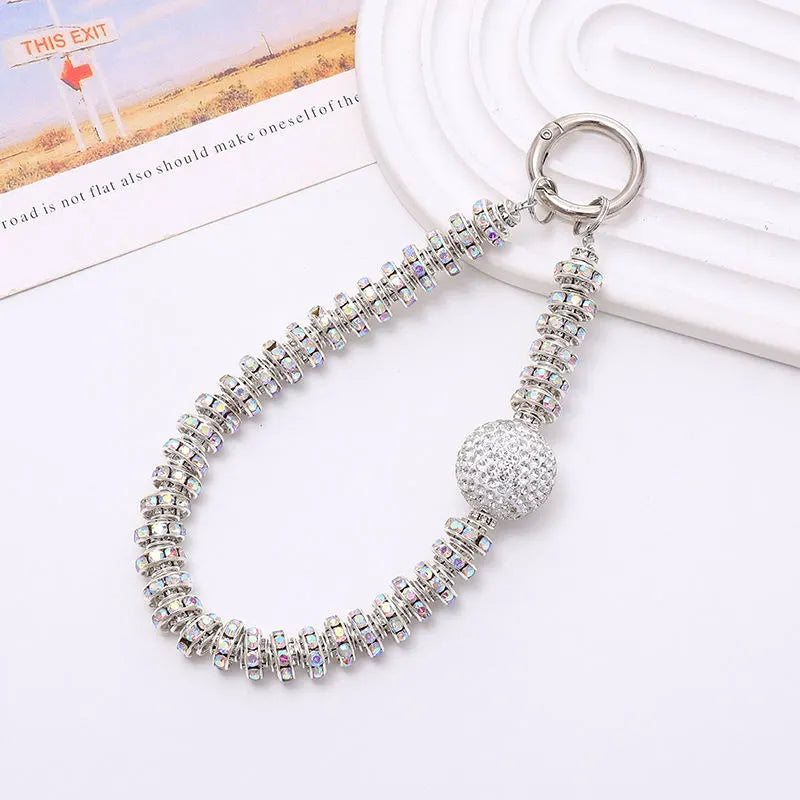silver phone charm with diamonds ball