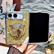 Open iPhone Duo in a gold Duo Butterfly Gleam glitter case with gold-tone butterfly stand