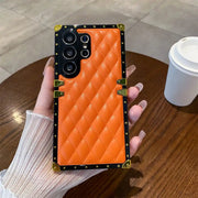 orange quilted Galaxy S26 Ultra trunk phone case in hand