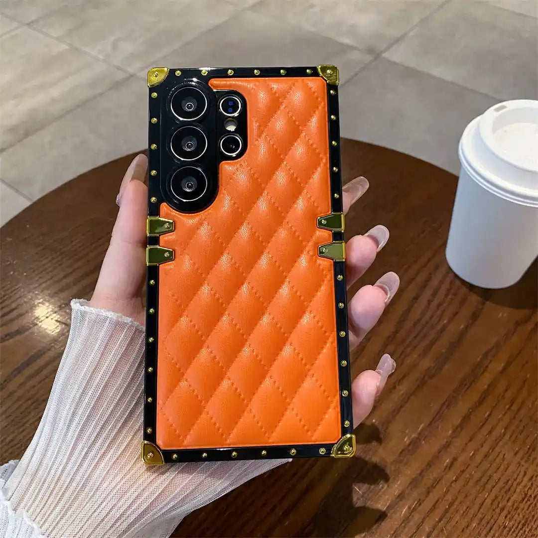 orange quilted Galaxy S26 Ultra trunk phone case in hand
