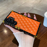 orange quilted Galaxy S26 Ultra trunk phone case in hand