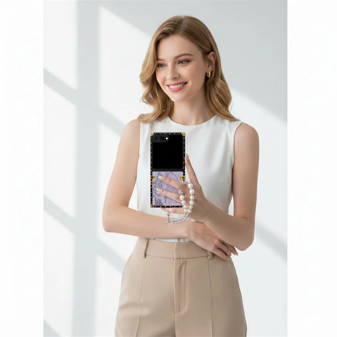 Woman holding a Galaxy Z Flip 7 phone with a white background