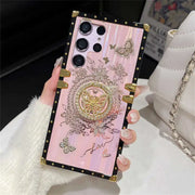 Pink Aurora Galaxy Trunk Samsung case held upright, showing butterfly details and gold-tone trim