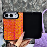 Open iPhone Duo in the orange Prism Scale Duo case with iridescent scale texture