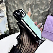 Side view of the mint blue Prism Scale Duo case on a folded iPhone Duo