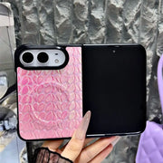 Open iPhone Duo in the pink Prism Scale Duo case with iridescent scale texture