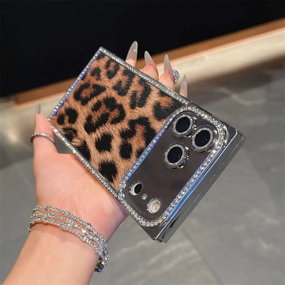 Brown Leopard Chrome Spark iPhone case held horizontally, showing leopard print and reflective camera panel