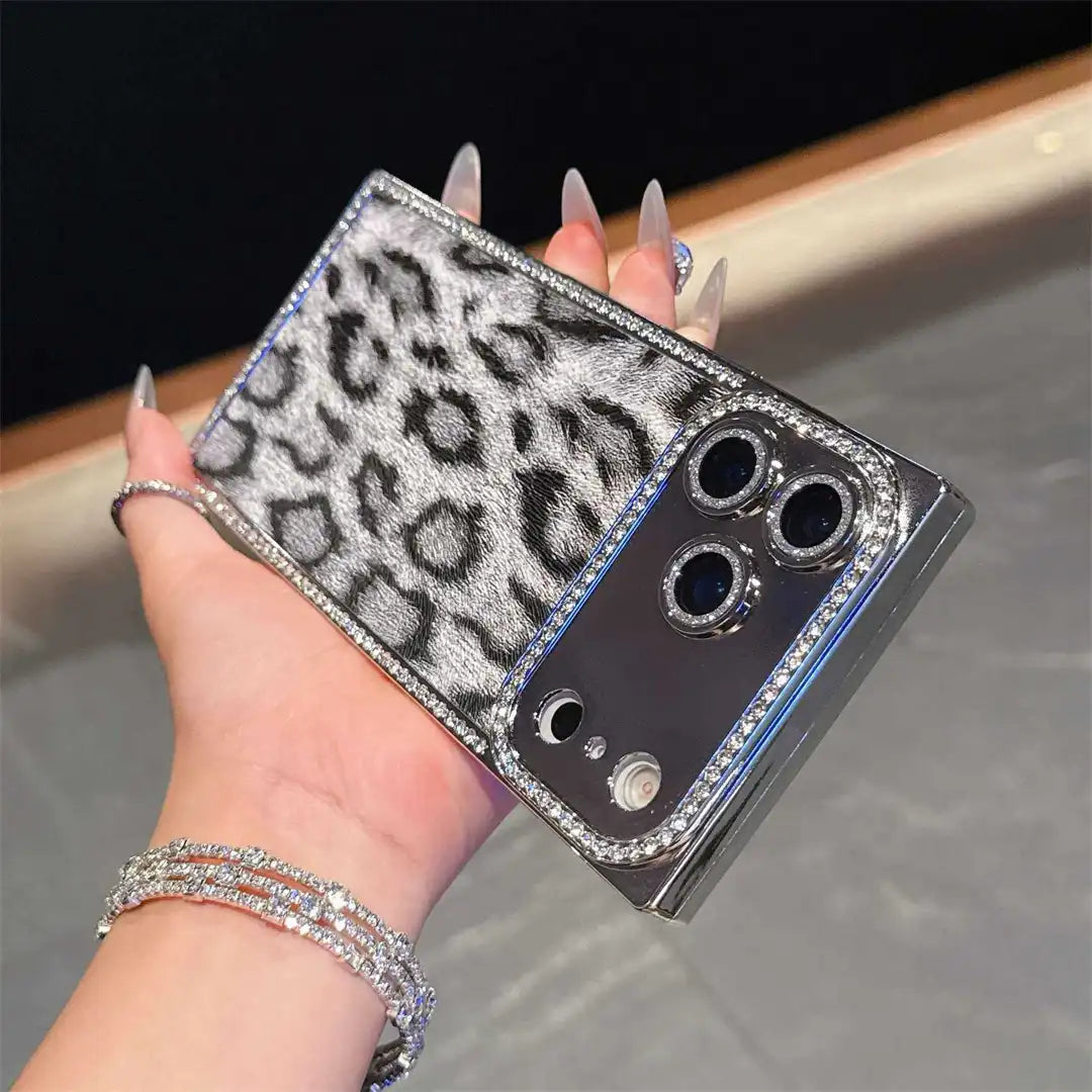 Gray Leopard Chrome Spark iPhone case held horizontally, showing leopard print and reflective camera panel
