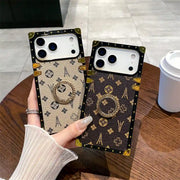 Brown and beige Paris Monogram Trunk iPhone cases displayed together in one hand