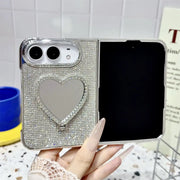 Open iPhone Duo in the beige Crystal Heart Duo case with rhinestone back and heart-shaped mirror