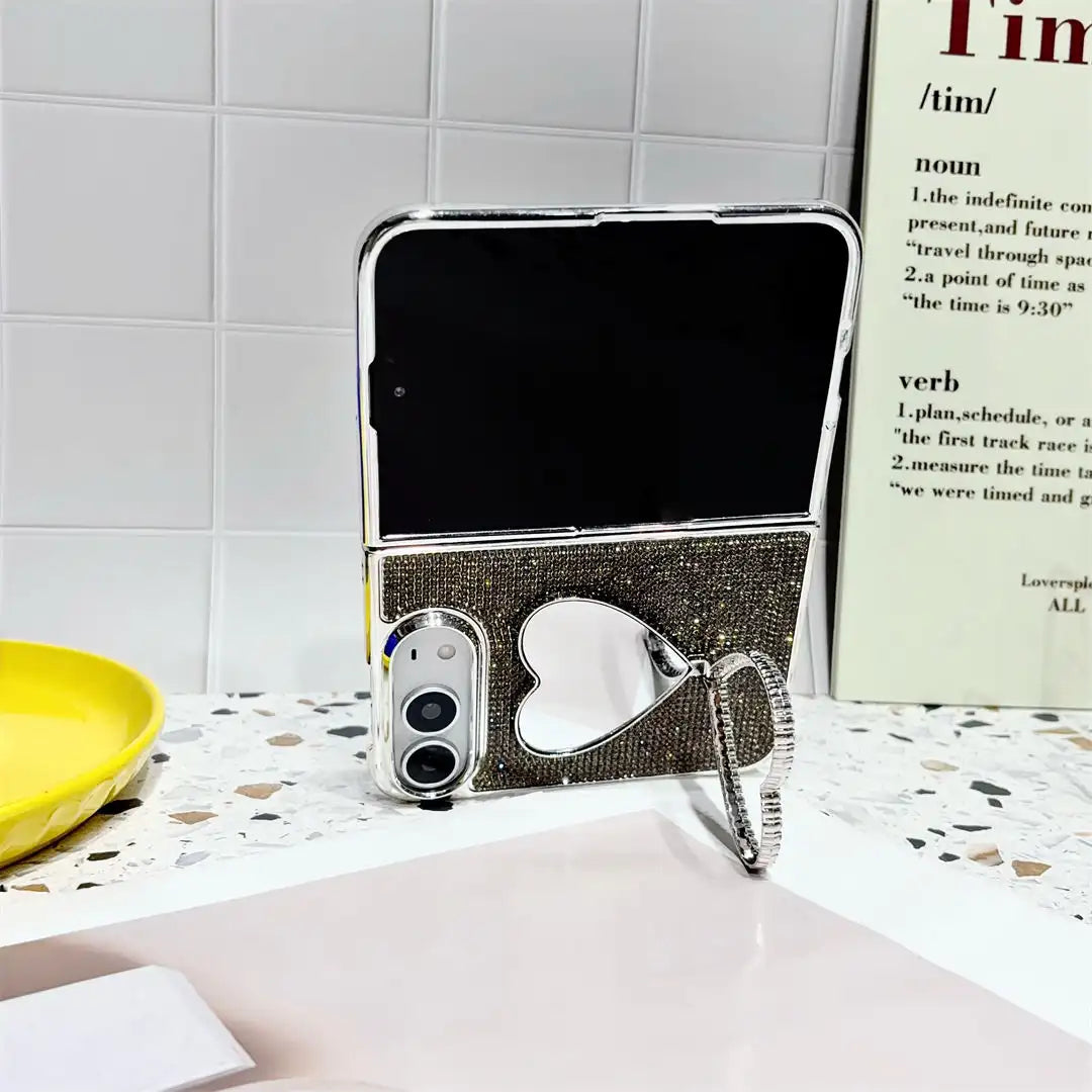 Black Crystal Heart Duo case holding an open iPhone Duo upright with the heart-shaped stand extended