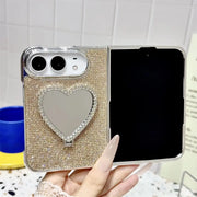 Open iPhone Duo in the gold Crystal Heart Duo case with rhinestone back and heart-shaped mirror
