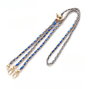 Gold chain with blue strap on a white background