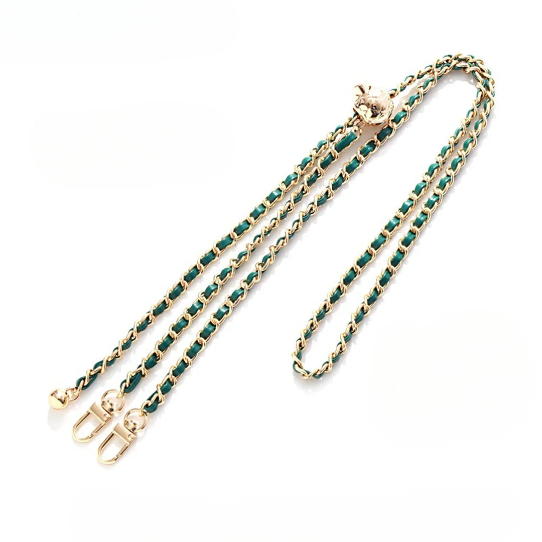 Gold chain with green beads on a white background