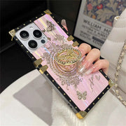 Close-up of the pink Aurora Butterfly Trunk iPhone case with the butterfly ring holder raised