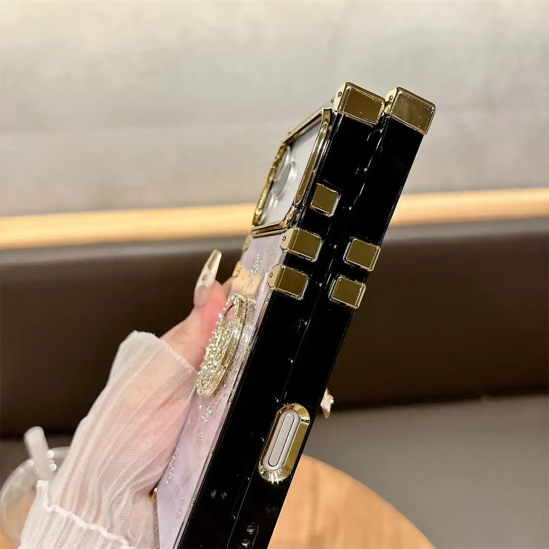 Side view of the Aurora Butterfly Trunk iPhone case showing its black frame and gold-tone button covers
