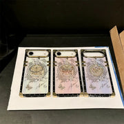 White, pink and purple Aurora Butterfly Trunk iPhone cases displayed side by side