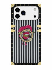 A protective phone case with a black and white vertical stripe pattern, gold-tone rivets, corner bumpers, and a central graphic of dripping pink lips holding a gold toothpick with the word 'FASHION' written inside.