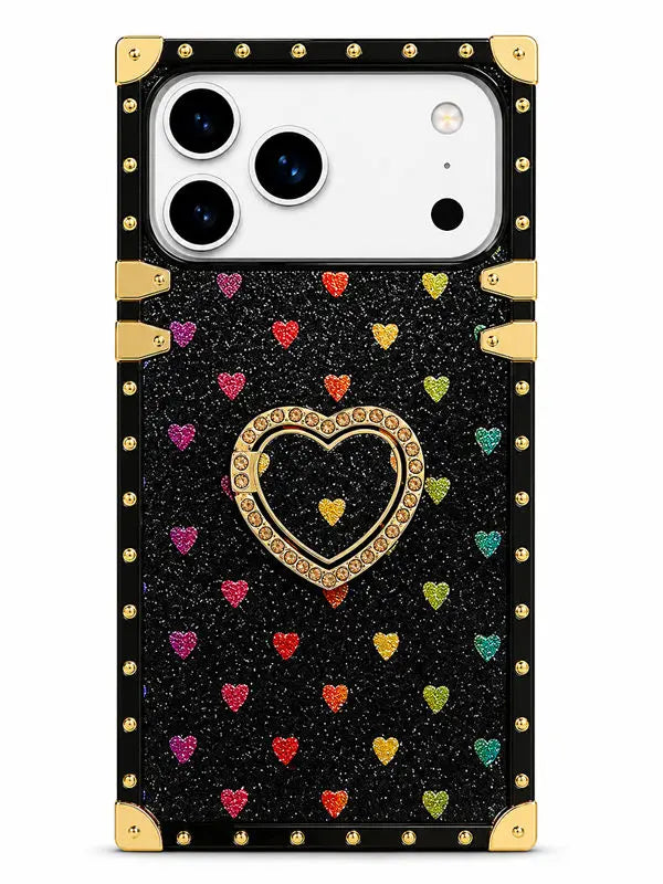 A black glitter phone case with gold trim, gold corner protectors, and a central gold heart frame. The case is decorated with small, colorful glitter hearts in pink, red, orange, yellow, green, and blue, and features a gold heart stand on the back.