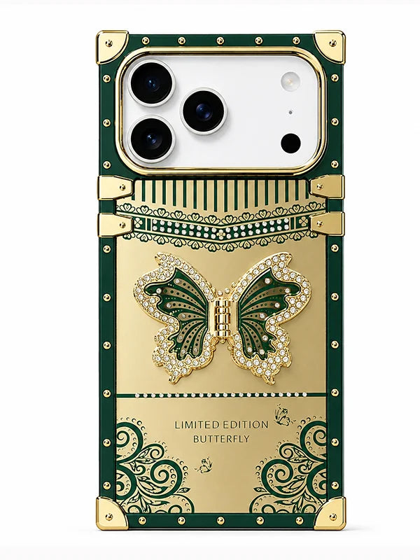 A luxury green and gold phone case featuring a 3D butterfly embellishment, decorative scrollwork, and gold-tone corner protectors, shown on a white background.
