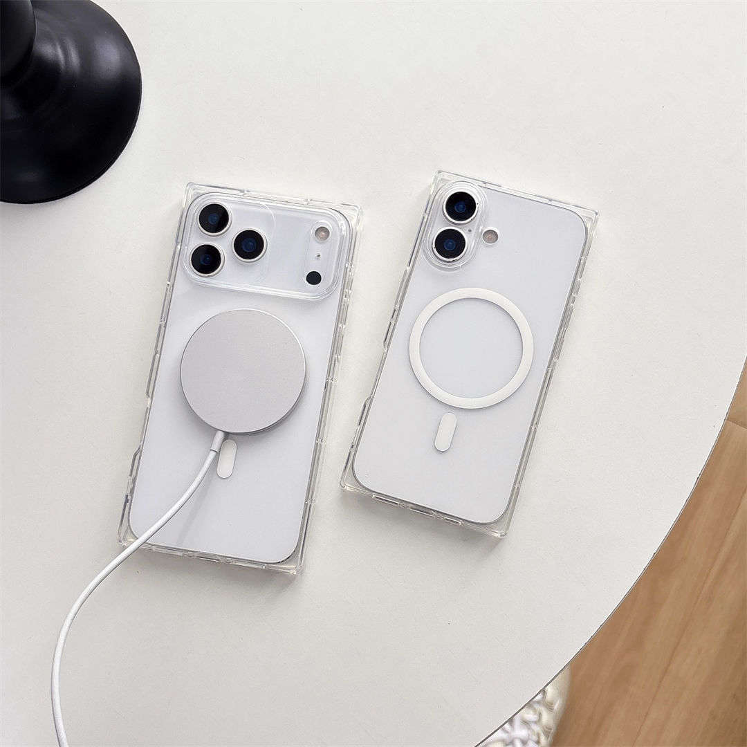 Two clear phone cases with magnetic charging ports on a light surface.