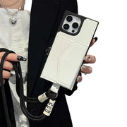 white wallet Phone case with card holder and lanyard held by a person