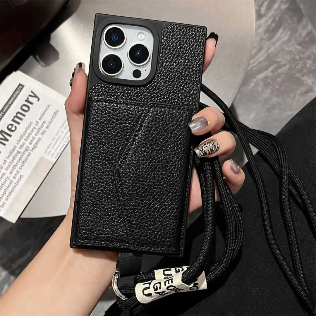 Black textured wallet phone case with lanyard held by a hand