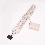 Floral-patterned strap with a black clip and beige pouch on a white background
