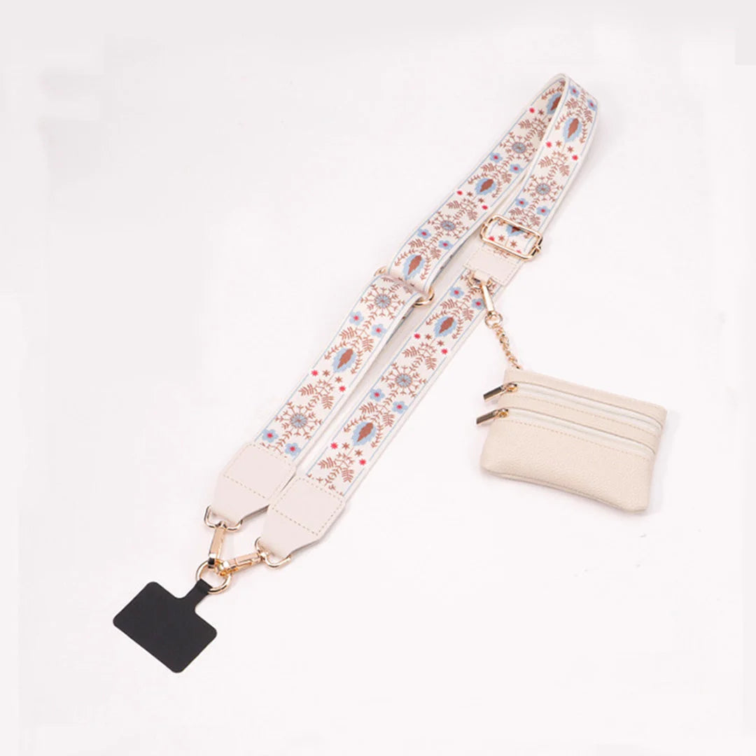 Floral-patterned strap with a black clip and beige pouch on a white background