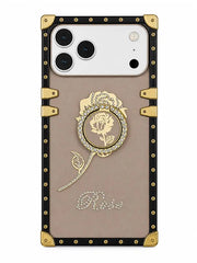 A luxury-style phone case featuring a beige center panel with a gold rose medallion, rhinestone script reading 'Rose', and a black border with gold corner protectors and rivets.